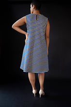 Load image into Gallery viewer, George tent dress sewing pattern. Designed by an independent pattern company. View B is collarless and sleeveless. Sample is made with blue and white striped knit jersey. Front view.